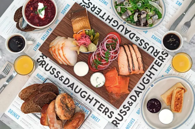 Seafood and breakfast food set out on creative style plating