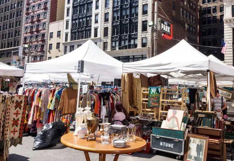 NYC's Best Markets: Food Markets, Flea Markets & More! | Like A Local Tours a group of people in front of a building