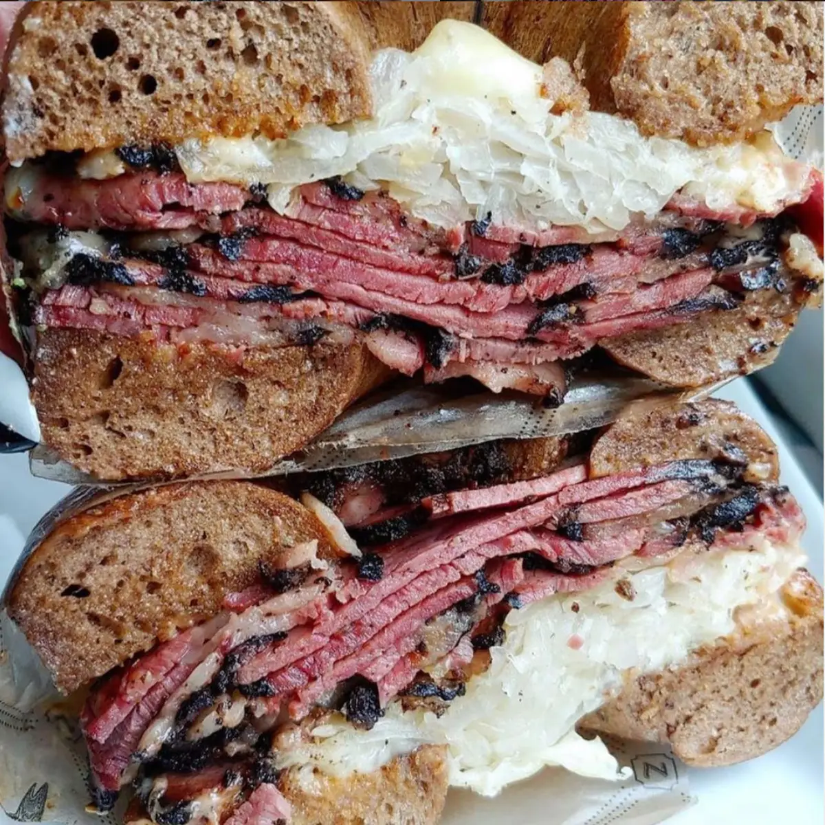 Introducing Zucker's Bagels - the Newest Addition to the Flatiron Food, History & Architecture Tour! | Like A Local Tours a close up of a sandwich on a plate
