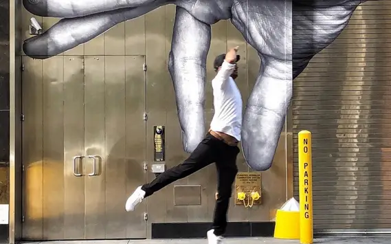 Art on Fifth! Lots to see on our Tour on Fifth, Fifth Avenue History Tour | Like A Local Tours person interacting with street art