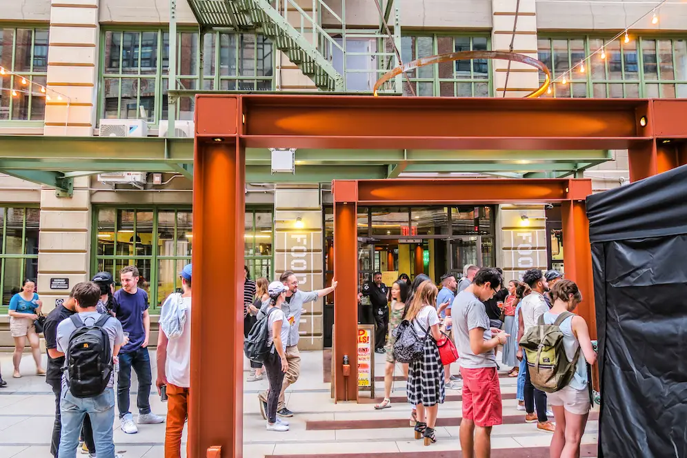 a group of people walking in front of a building