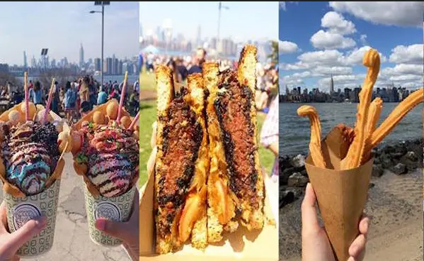 a person holding a hot dog