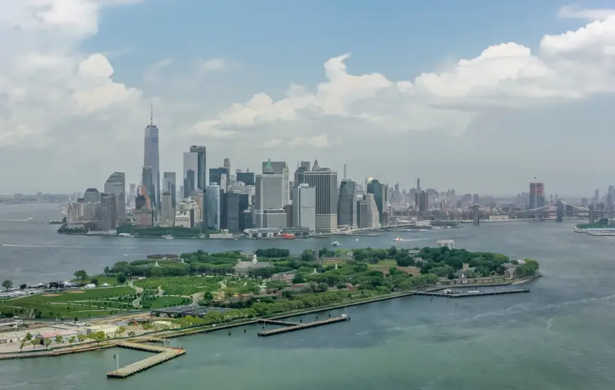 a body of water with a city in the background
