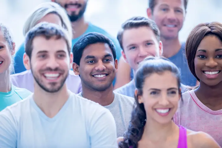 a group of people smiling and posing for a photo