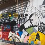 harlem street mural of woman with megaphone