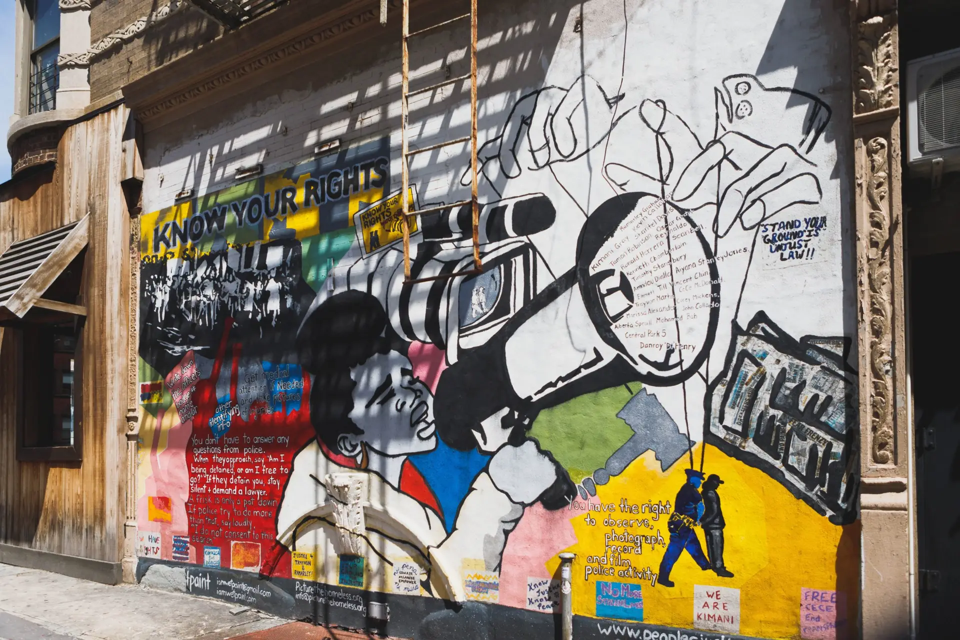 harlem street mural of woman with megaphone