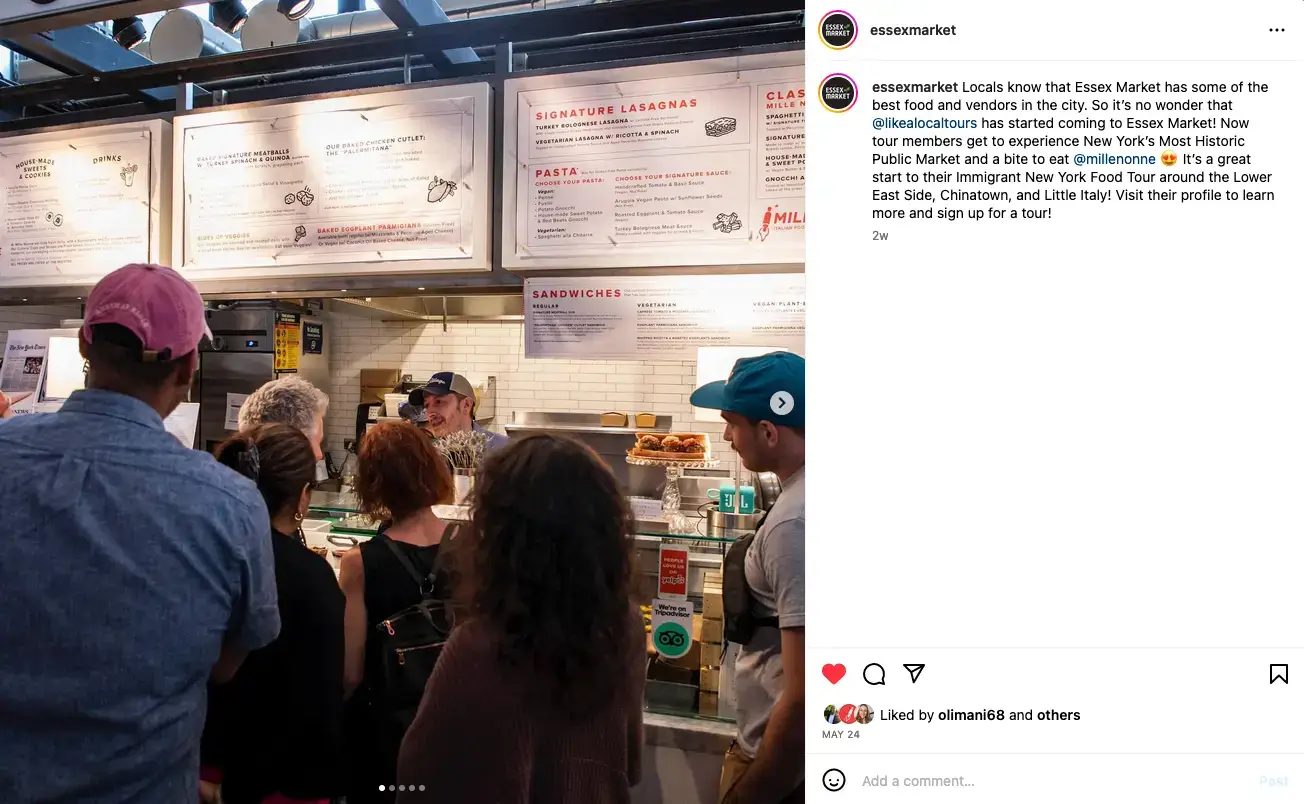 Mille Nonne & Essex Market on our Immigrant NY: Lower East Side Food Tour! | Like A Local Tours a man and a woman standing in front of a store