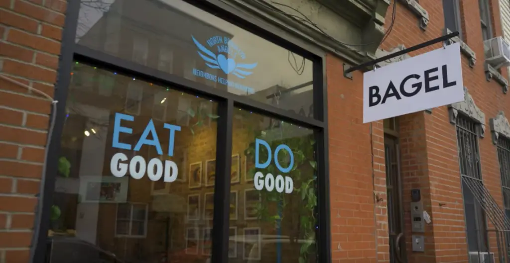 a sign above a storefront on a brick building