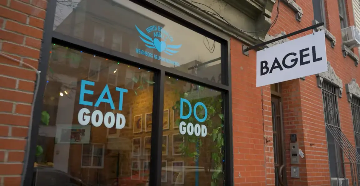 a sign above a storefront on a brick building