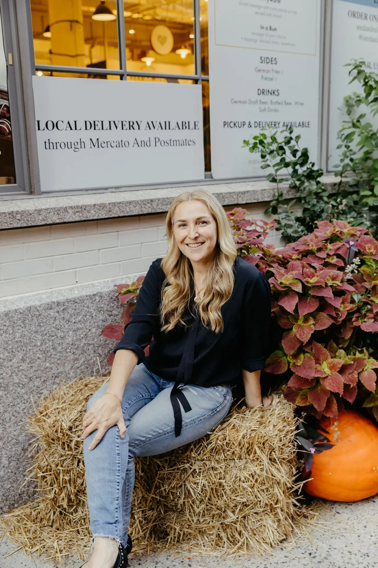 a woman standing in front of a building