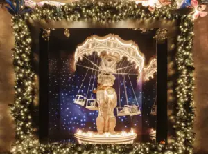 a fountain in front of a christmas tree