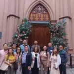 a group of people standing in front of a building