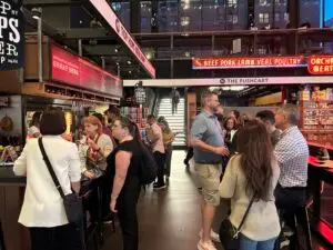 a group of people standing in front of a store