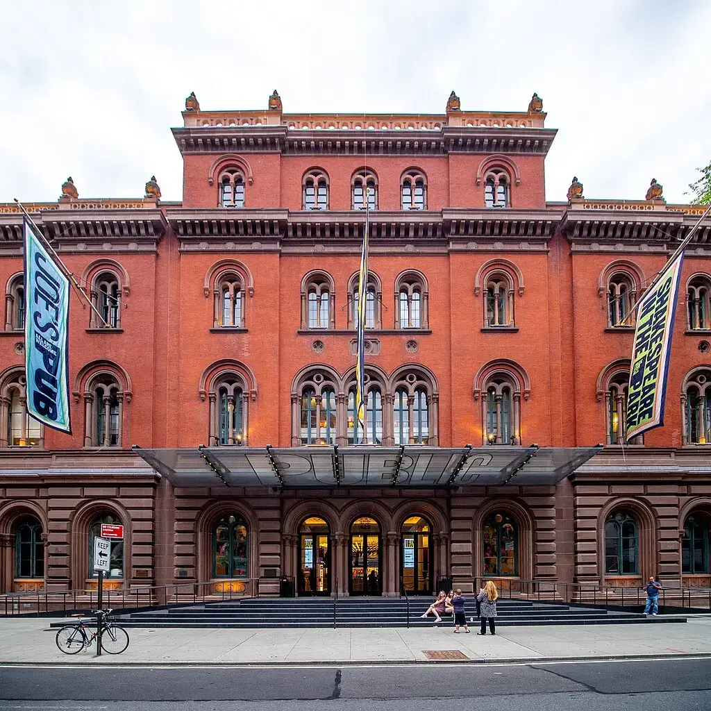 a group of people in front of a building