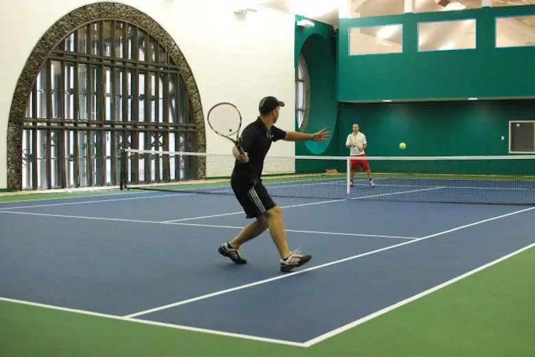 a person on a court with a racket
