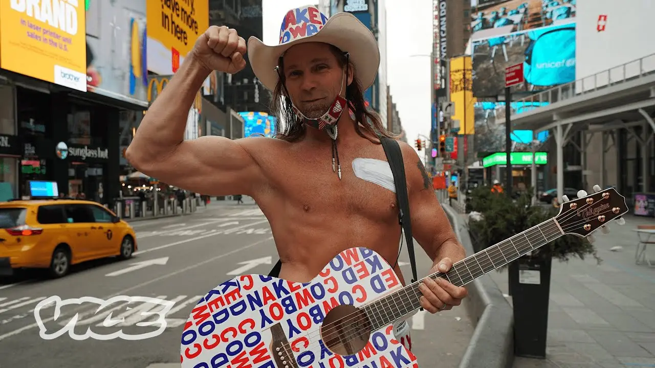 Naked Cowboy is walking down the street