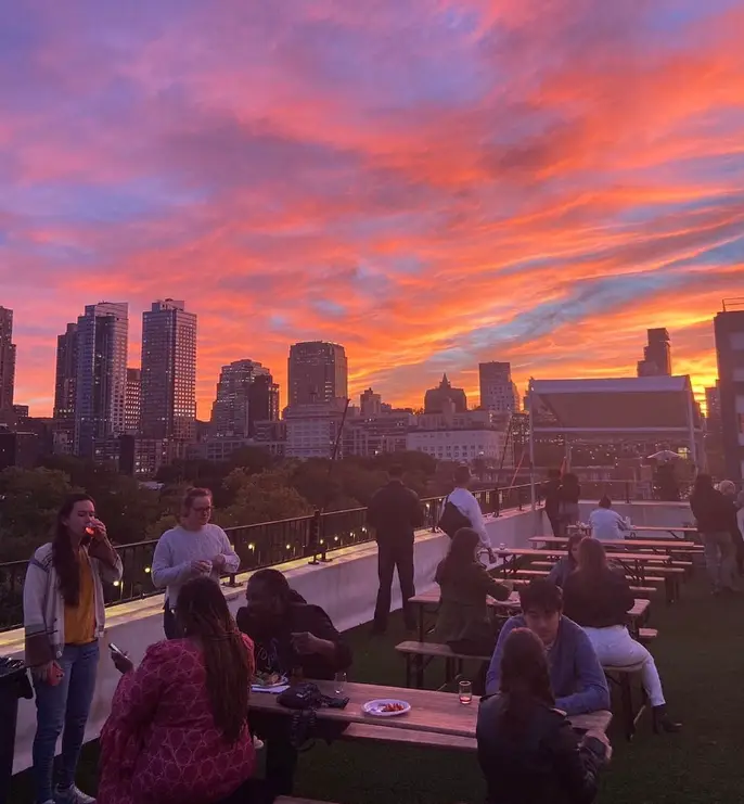 a group of people on a rooftop in nyc