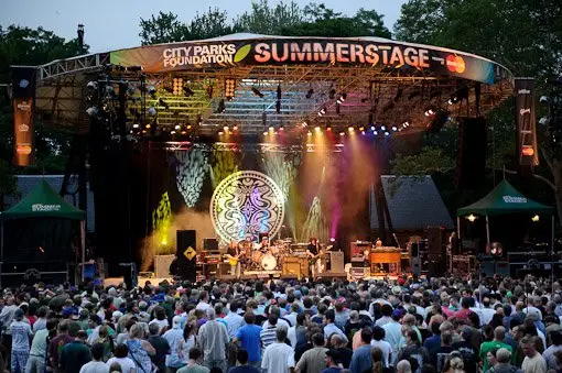 a group of people standing in front of a crowd