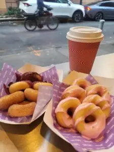 food on a table next to a cup of coffee