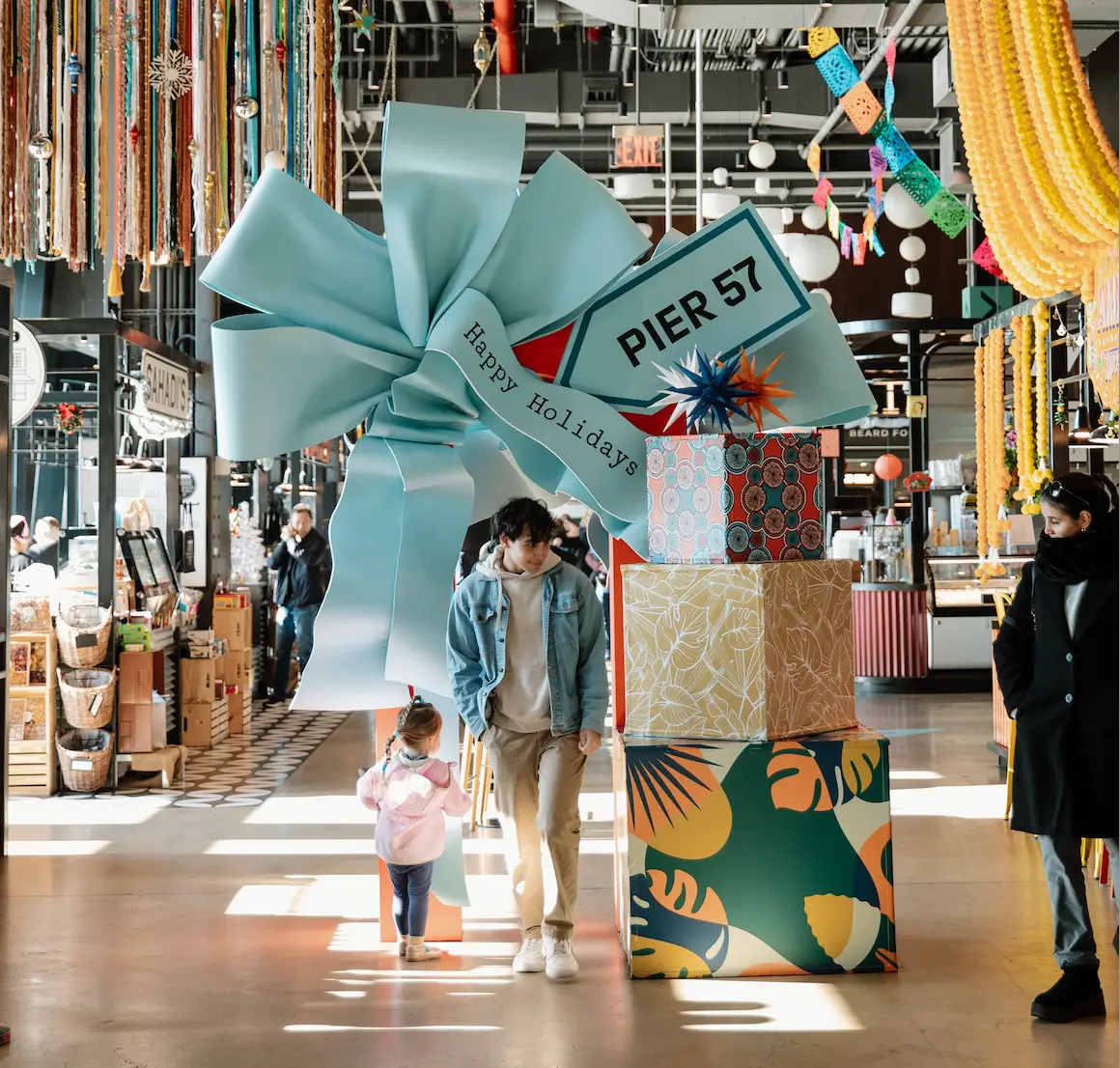 A Festive Guide to Christmas and Holiday Cheer in New York City with Like A Local Tours | Like A Local Tours a group of people in a store