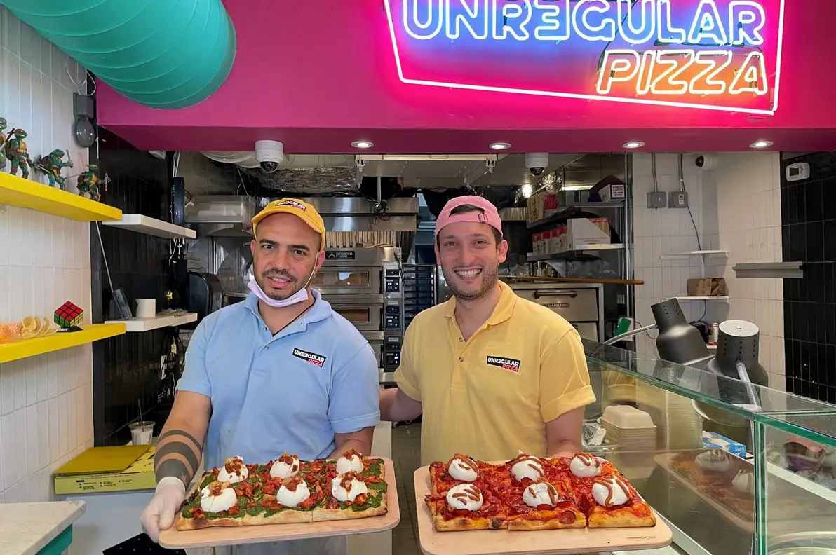 photo of servers at unregular pizza
