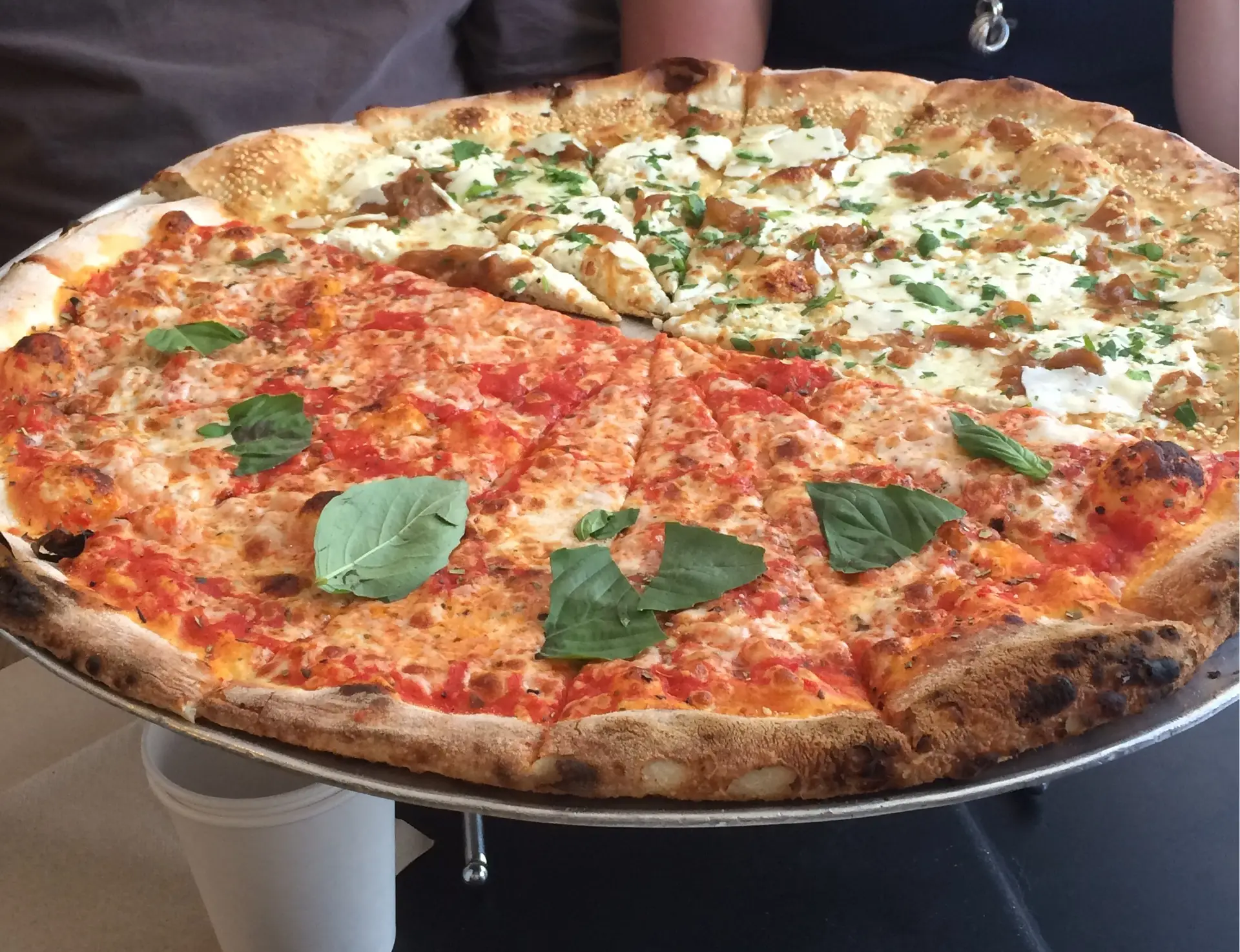 a pizza sitting on top of a metal pan