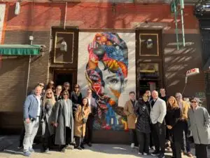 Corporate group outside of street art in new york city