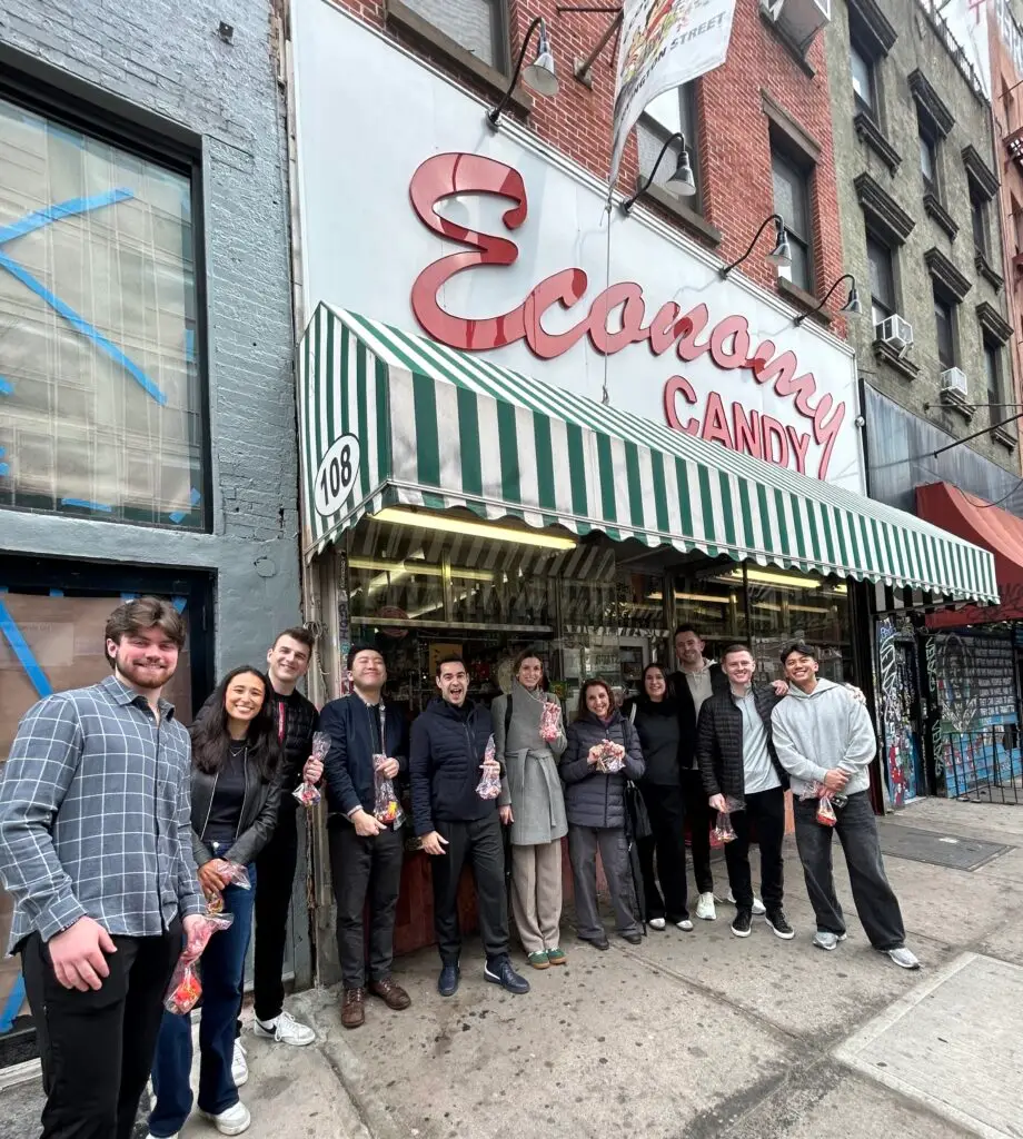 a group of people standing in front of Economy Candy