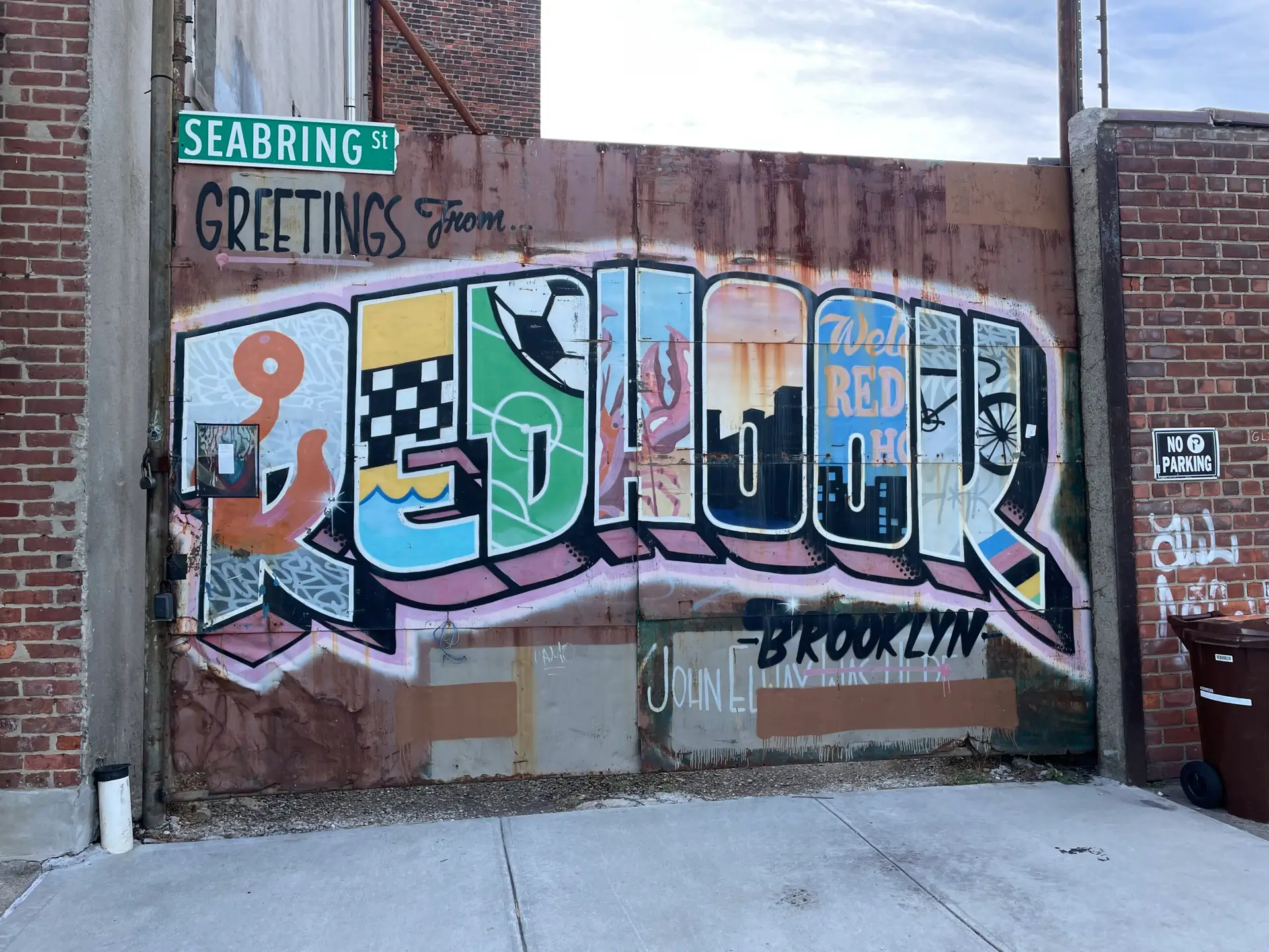 Colorful 'Greetings from Red Hook, Brooklyn' street mural on Seabring Street