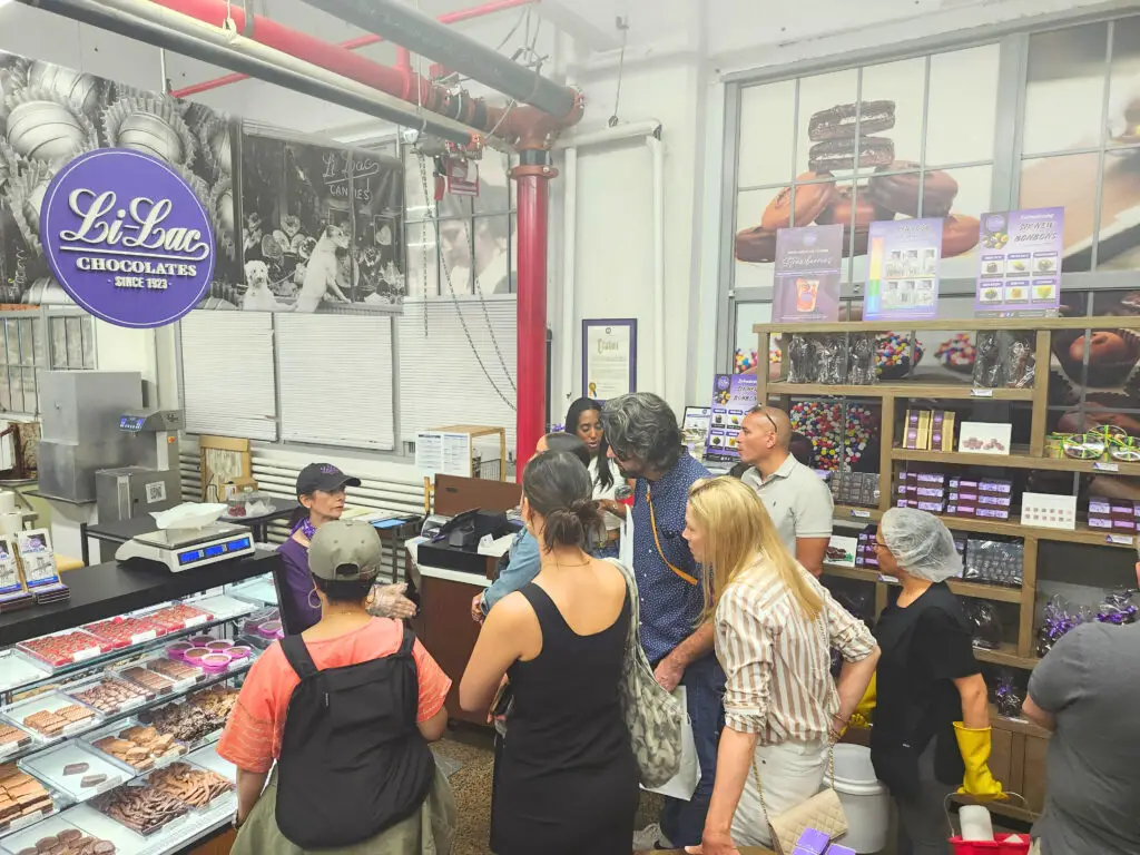 A group of people tour Li-Lac Chocolates at Industry City, Brooklyn.