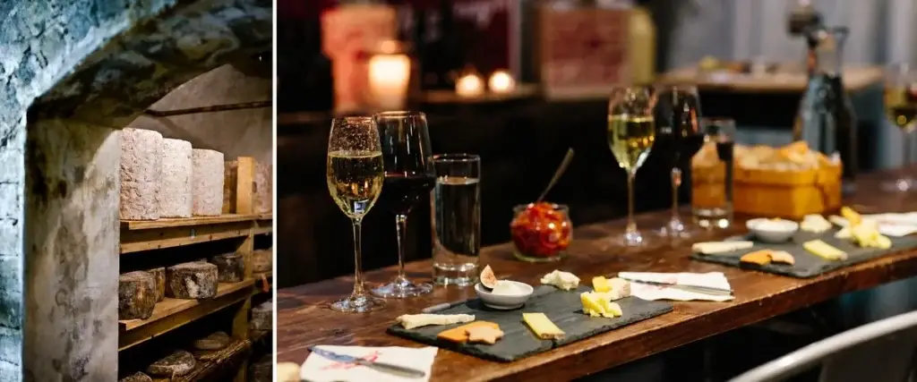 8 NYC Corporate Holiday Party Ideas for Teams That Love Food, Drinks & a Little Adventure | Like A Local Tours Wheels of cheese aging in a stone cellar beside a candlelit wine and cheese tasting table