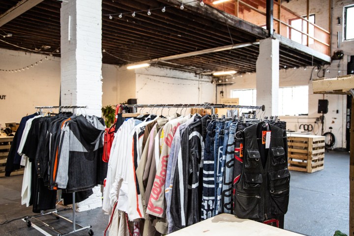 shopping warehouse with rack of clothes in the middle of store