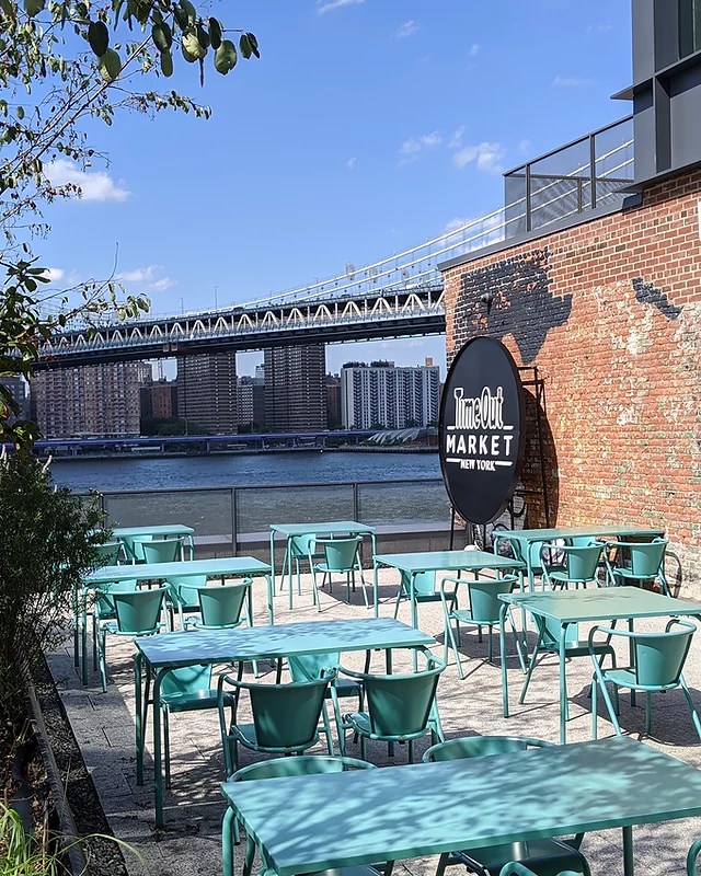 patio overlooking water with bridge