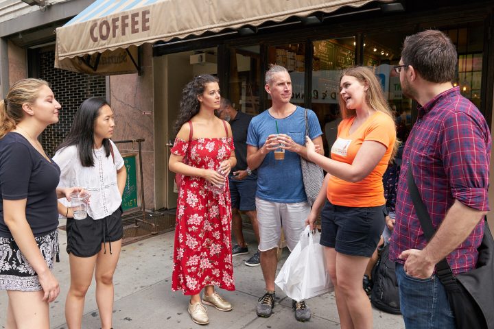 a group of people standing in front of a building